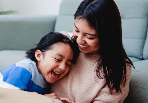Mother with child in living room
