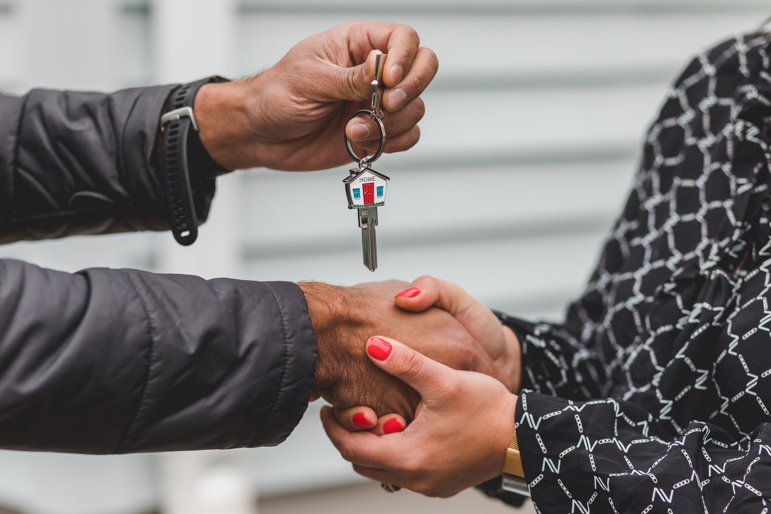 Realtor giving house keys to homeowner