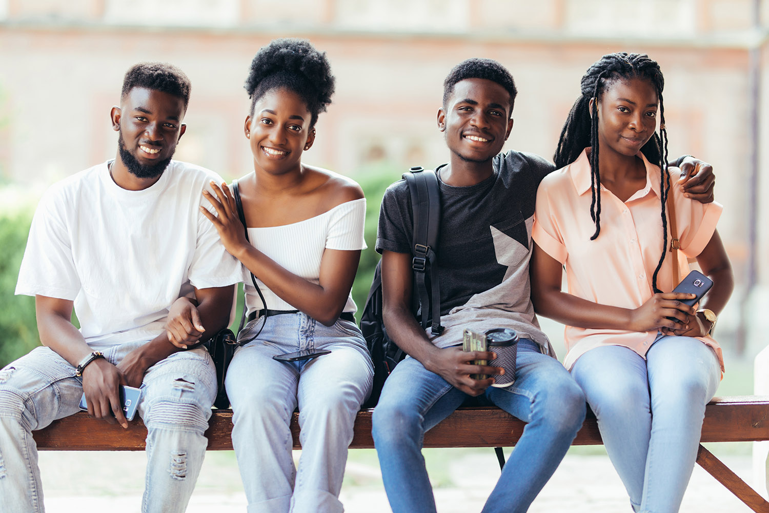 Group of youth sitting on bench
